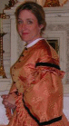 Silk day dress with ruffles and velvet trim.